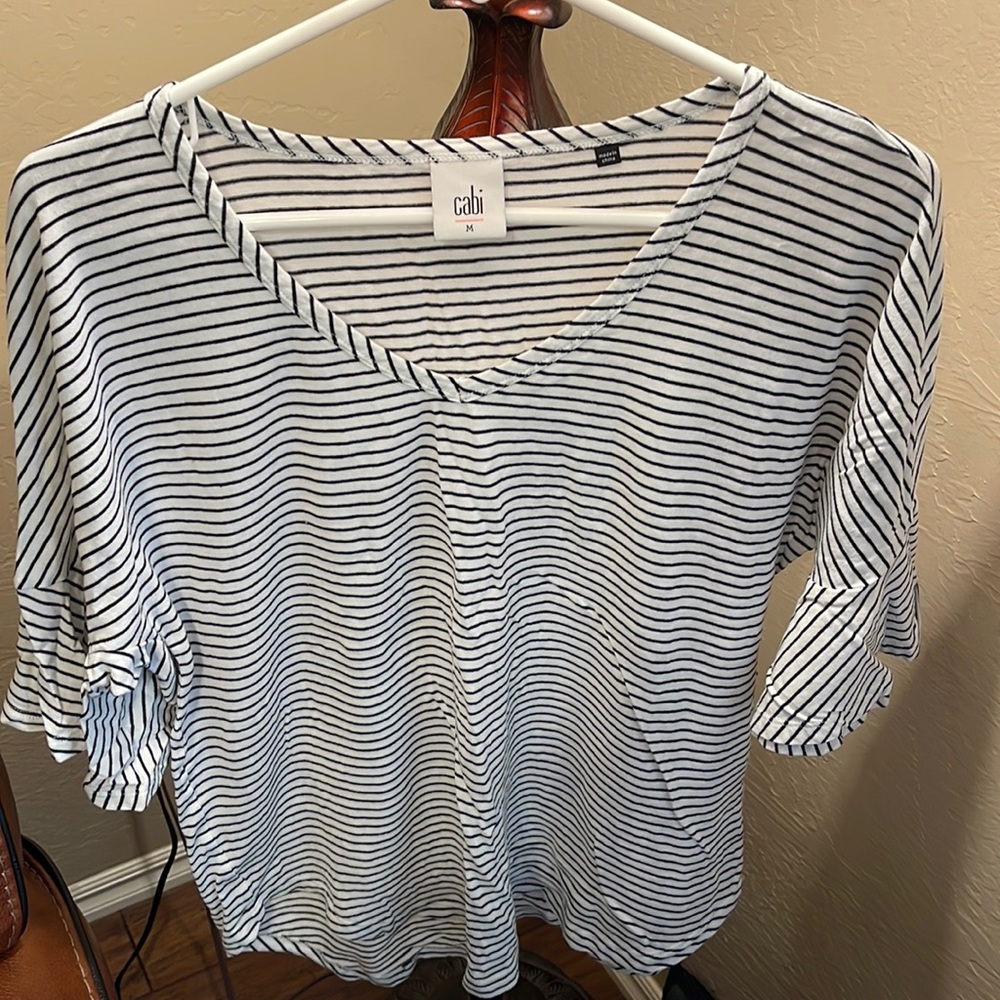 Cabi white tee with black stripes and ruffled sleeves